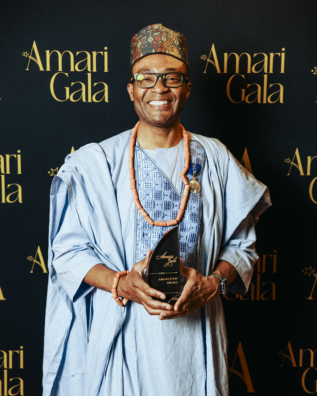 Fred Alale AM, 2026 AMARI Icon Award winner, holding the AMARI Trophy